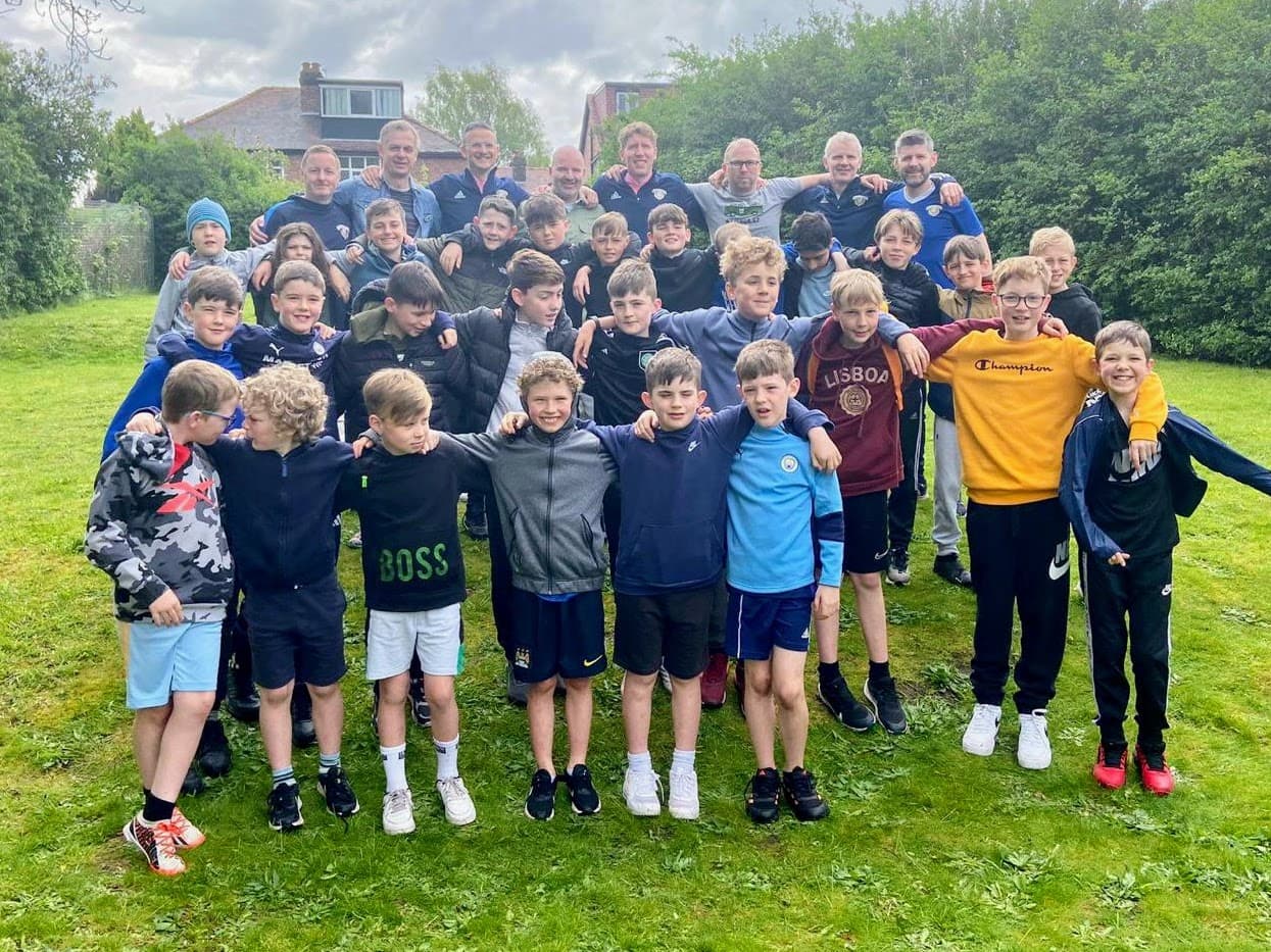 Spartinios players and coaches together on tour