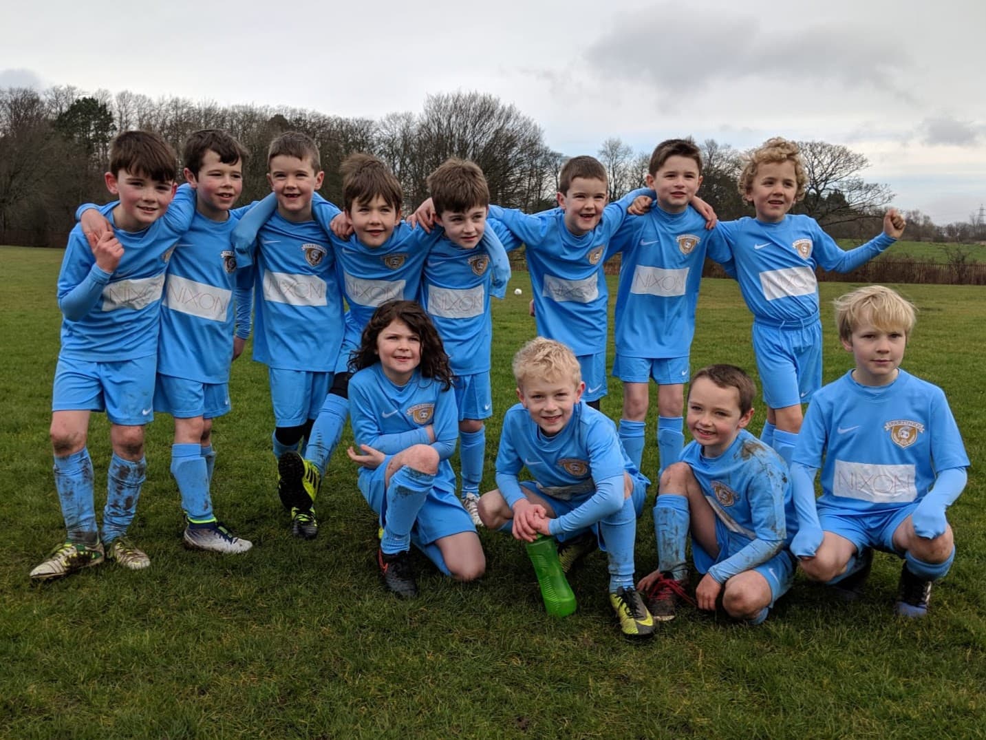 An early Spartinios league squad lined up together in blue kits